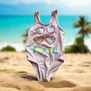 18-24 pink one piece swimsuit. old Navy. Sunglasses pattern. “Just happy”